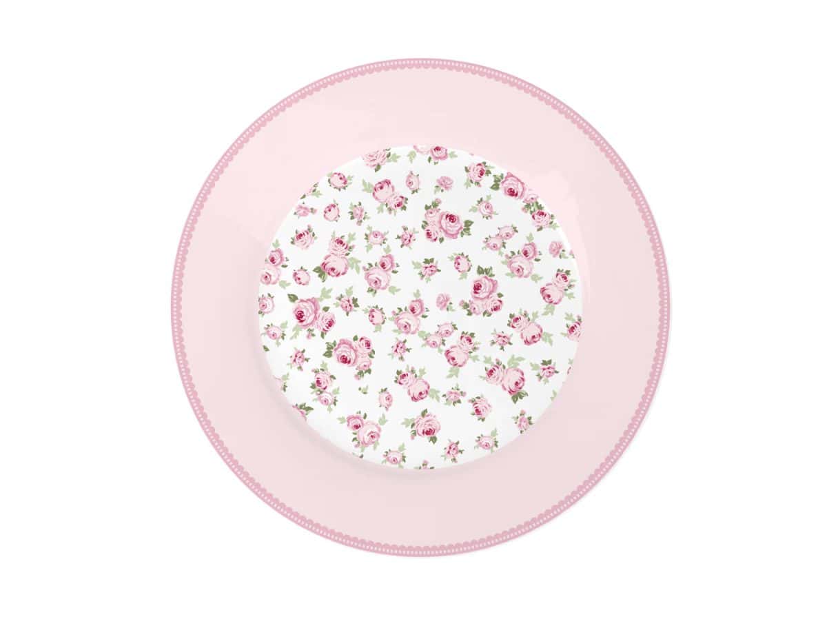 Розова чиния с флорален мотив върху нея.